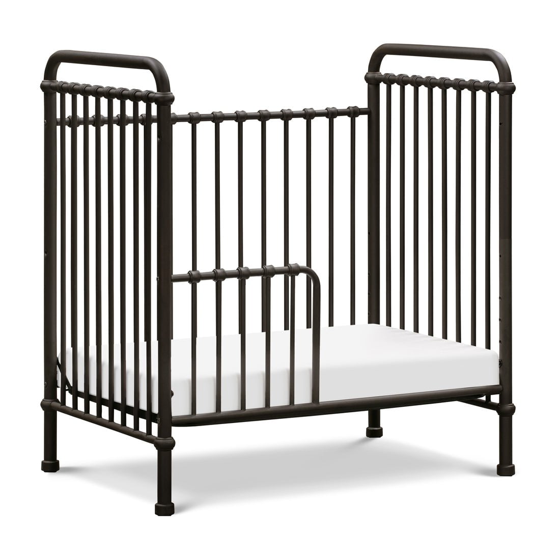Dark metal crib with vertical bars and a white mattress, featuring rounded edges and a minimalist design.
