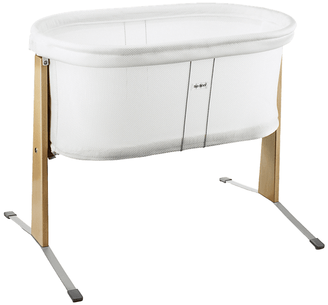 A white bassinet with mesh sides, wooden legs, and a sleek modern design.